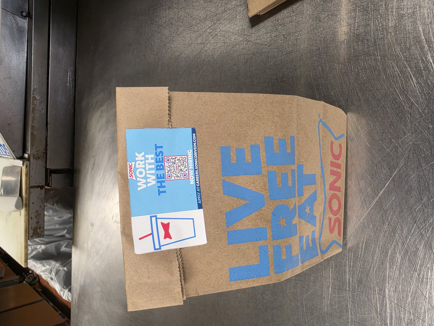 Custom Sonic bag decal applied to a paper bag